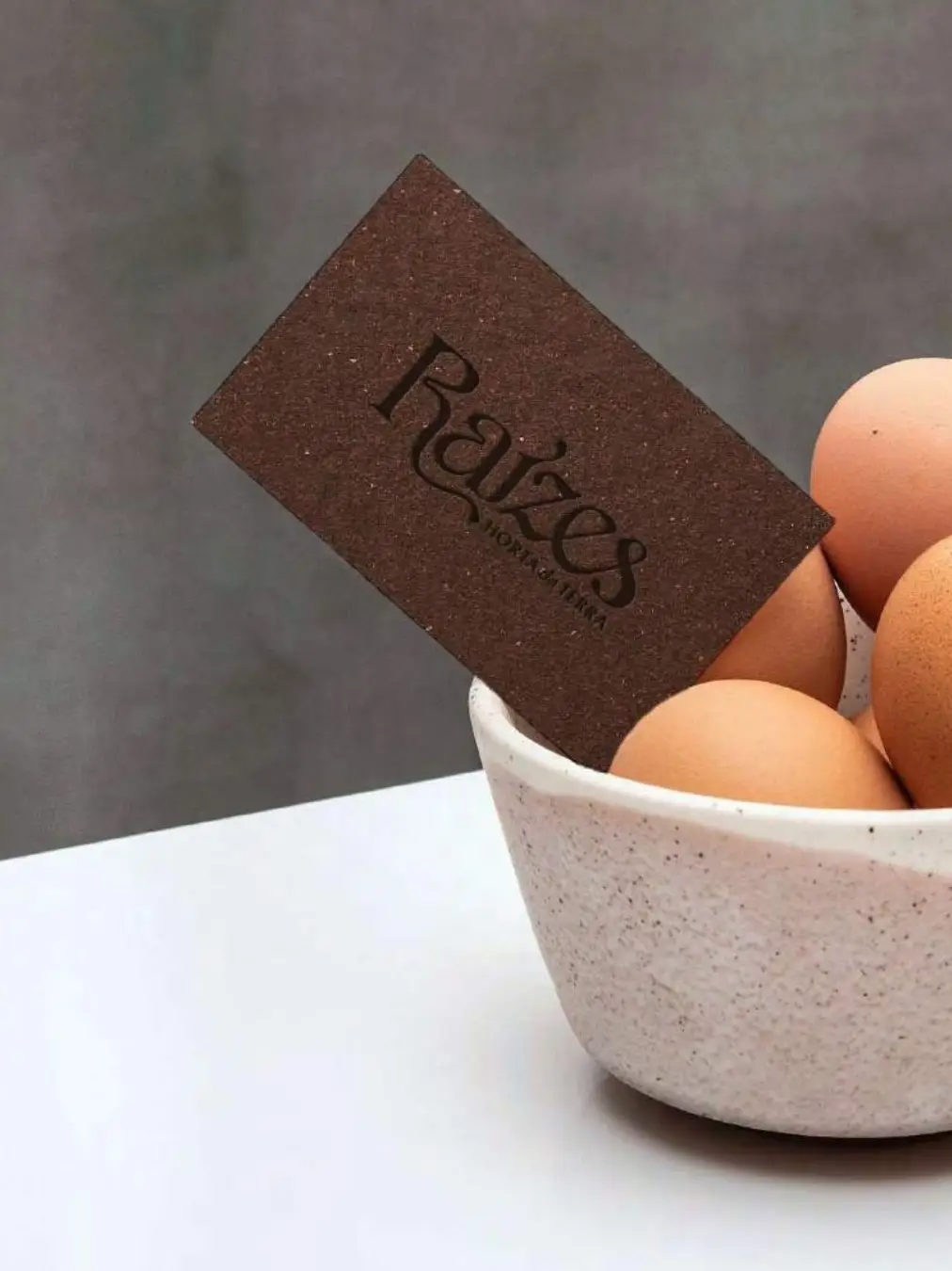 Eggs in bowl with Raízes card at Raízes, Horta da Terra