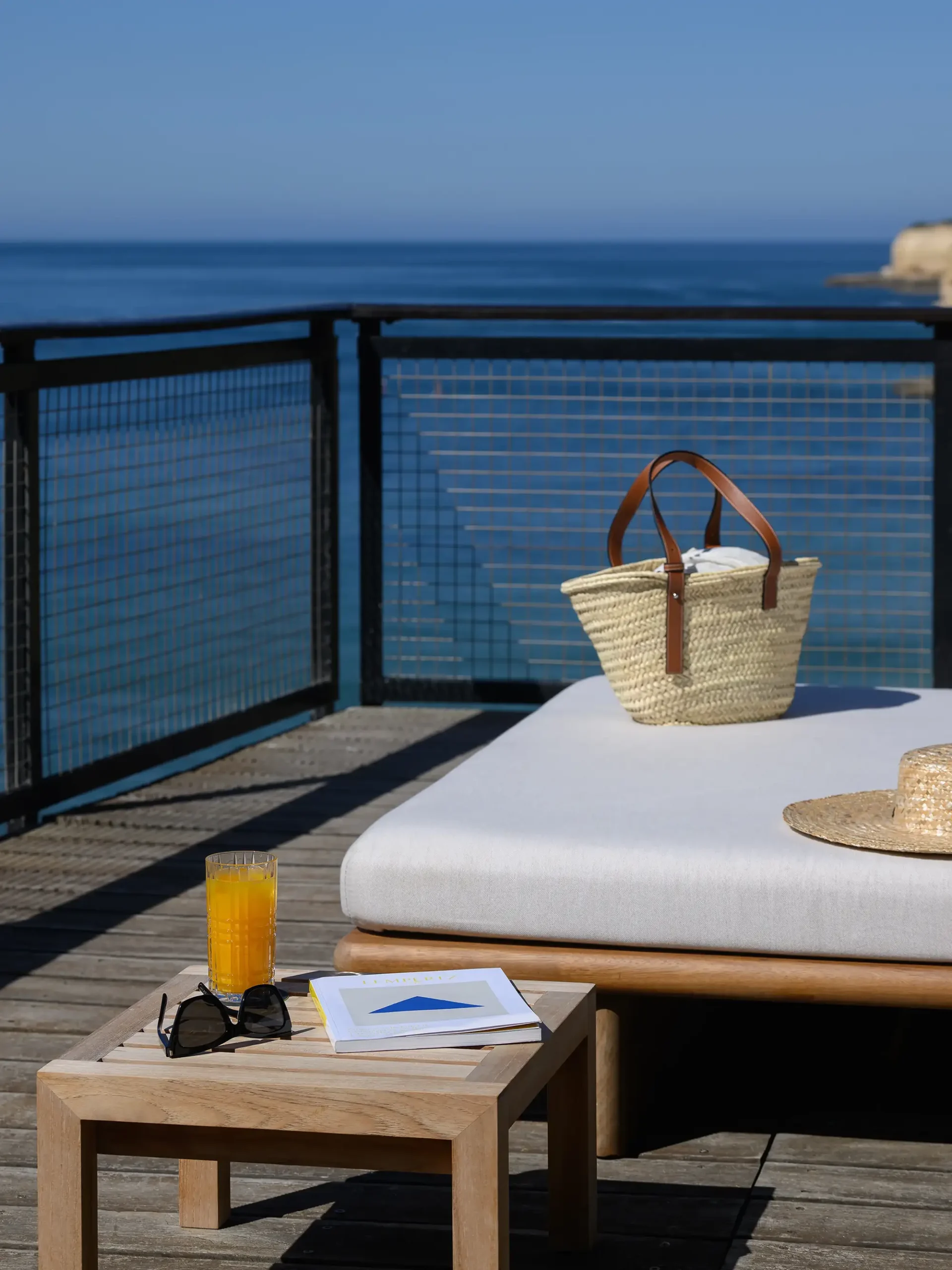 Sunbed with basket facing the sea at A Costa Restaurant