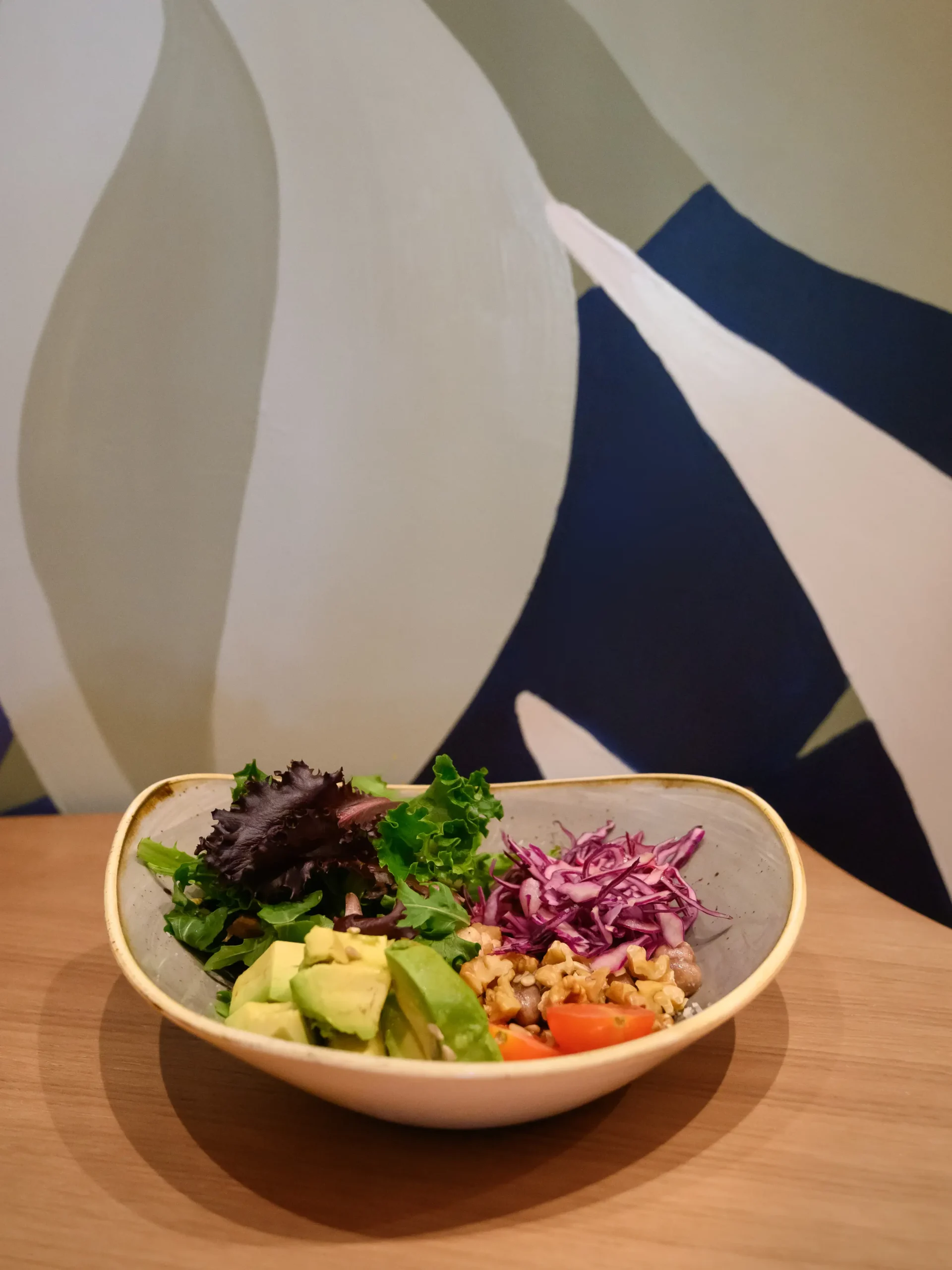 Salad bowl with mural at Vento Restaurant