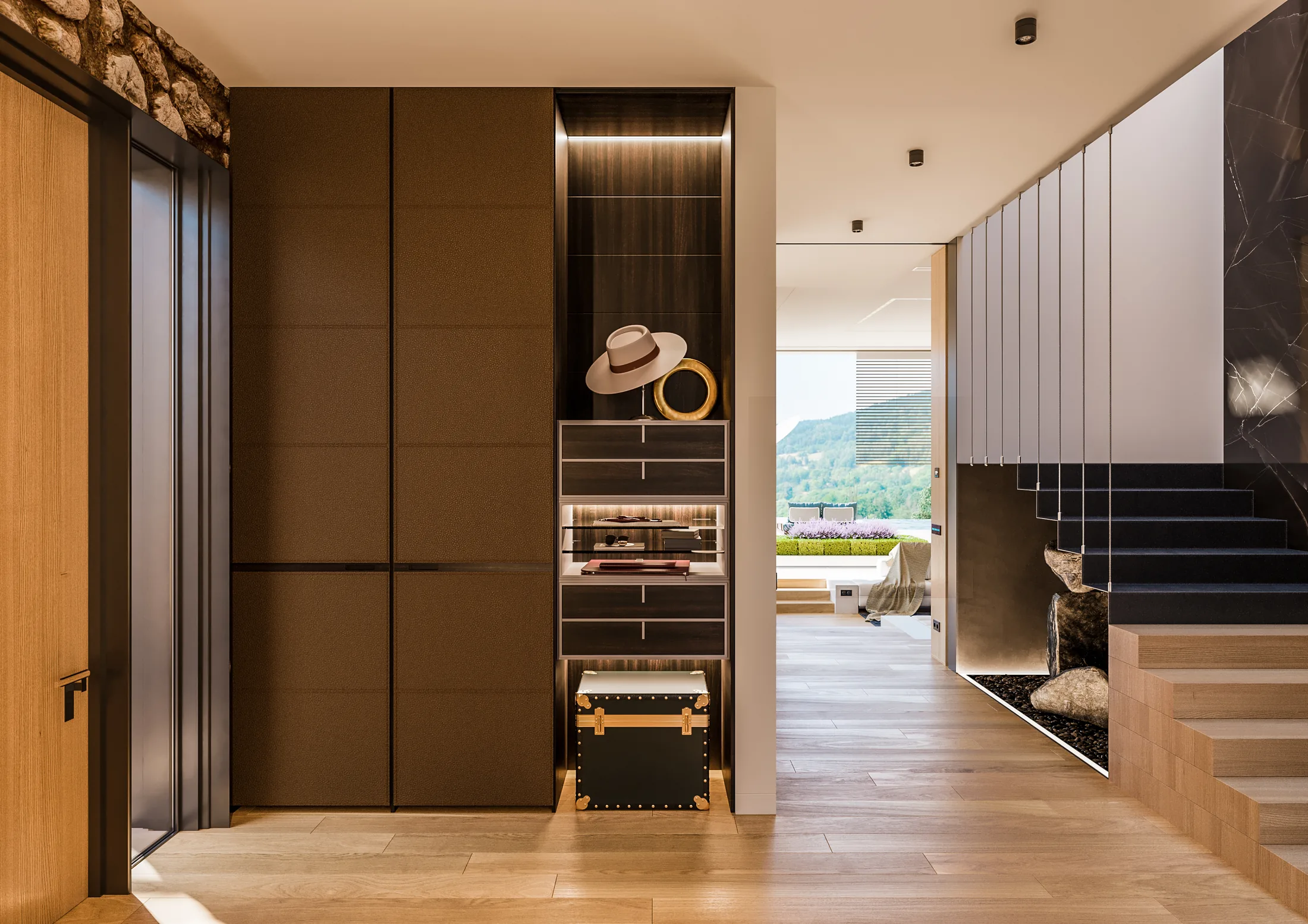 Modern hallway with dark wood joinery and a view out to the garden