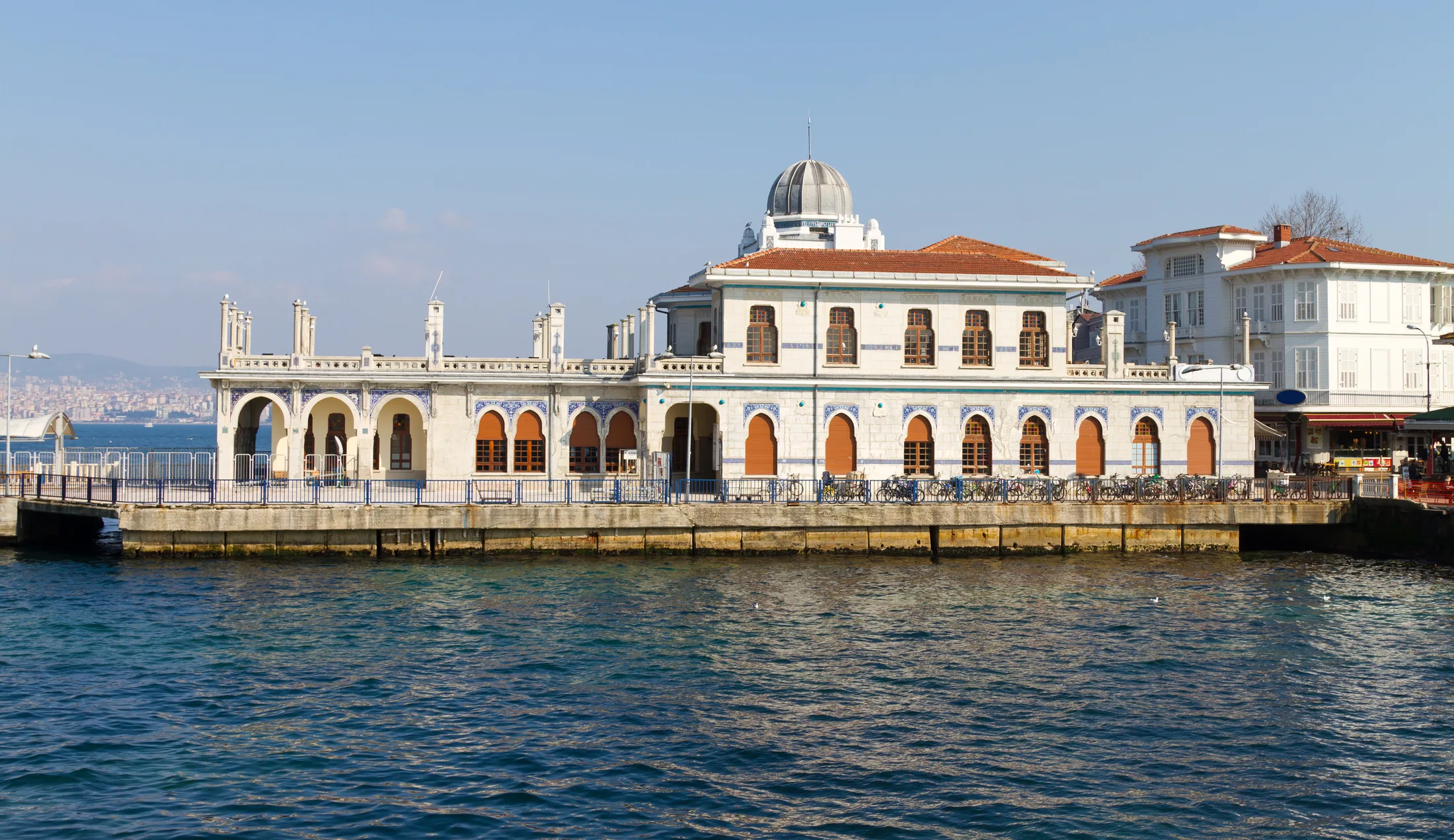 Historic passenger pier with an arched facade on the Istanbul waterfront