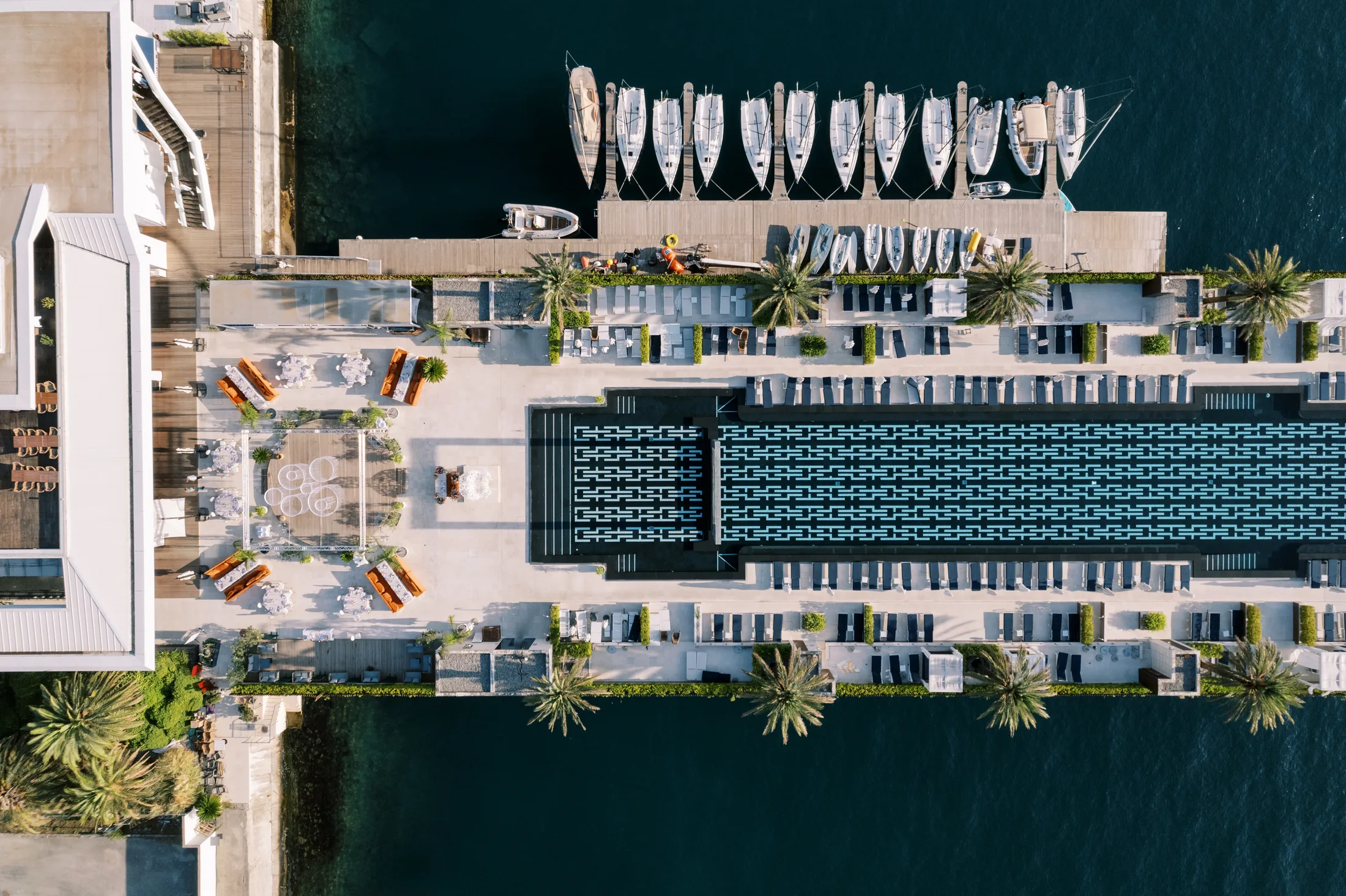 PSC-News-Next-Traveller-03 · Permanent State of Creation Aerial view of the yacht club pool and marina in Porto Montenegro
