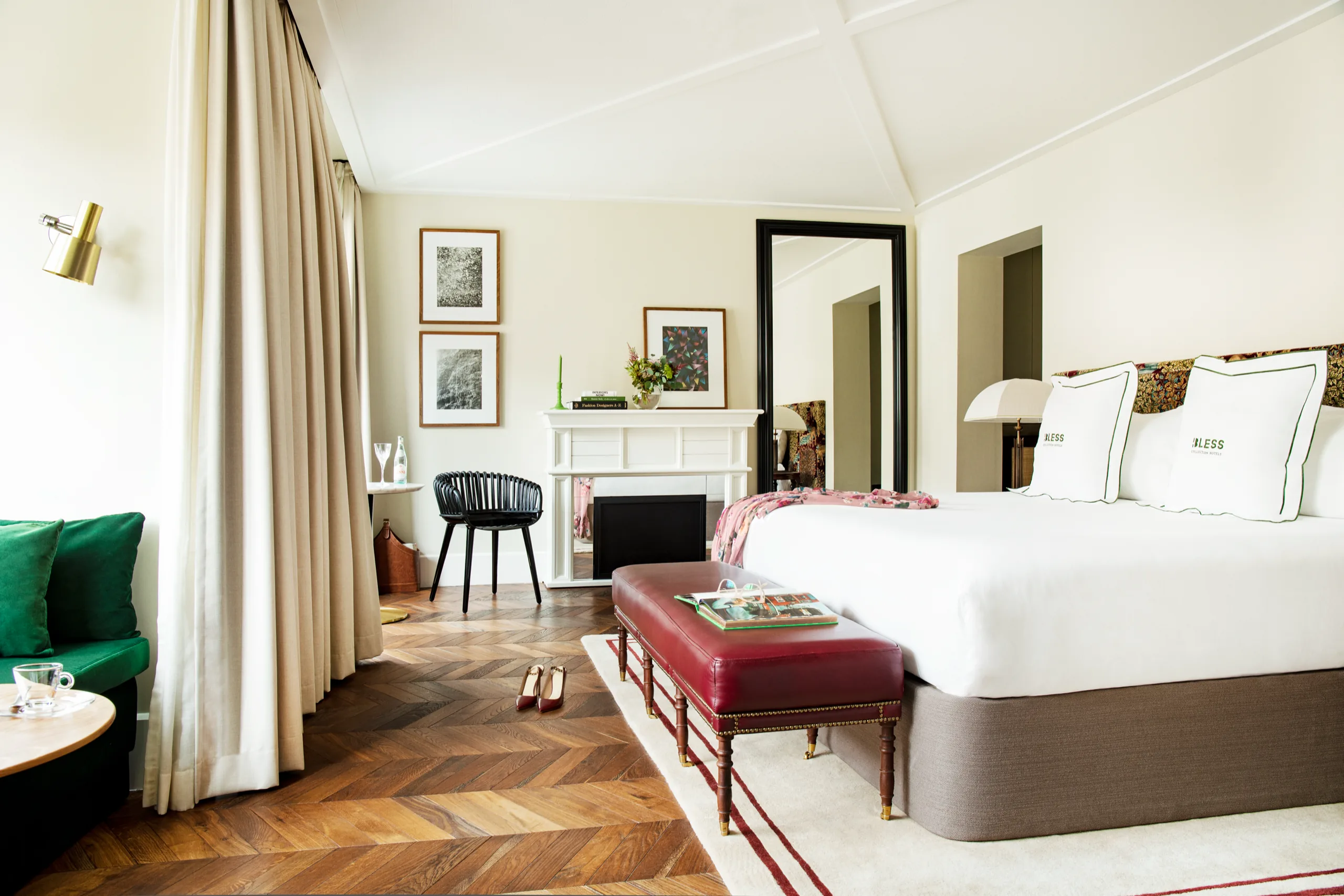 Bright bedroom with green chair and red bench, BLESS Madrid