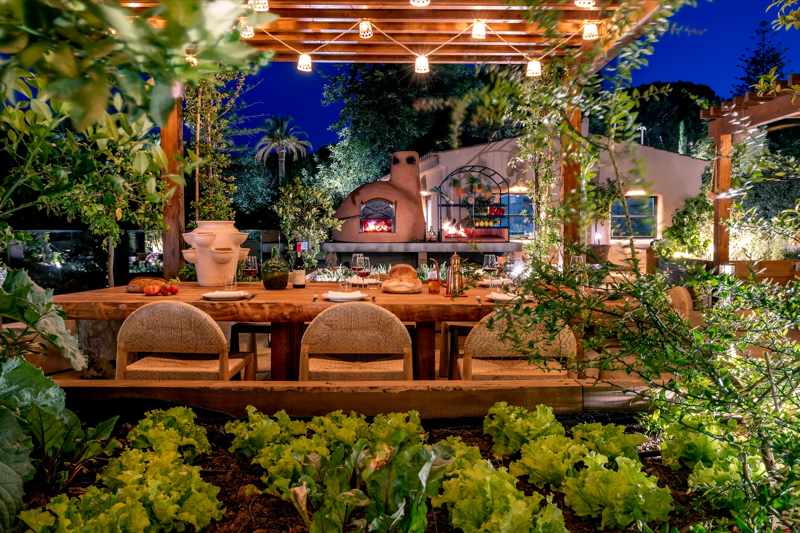 Long table at night at Raízes, Horta da Terra